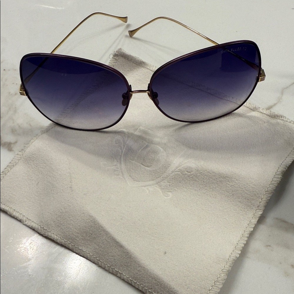 Elegant Purple Sunglasses with Gold Accents
